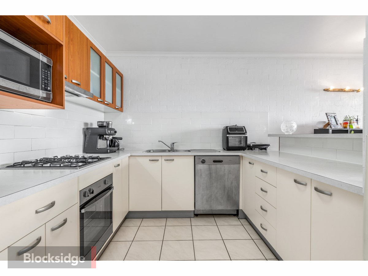 Breezy TopFloor Apartment with Dual Balconies Blocksidge & Ferguson