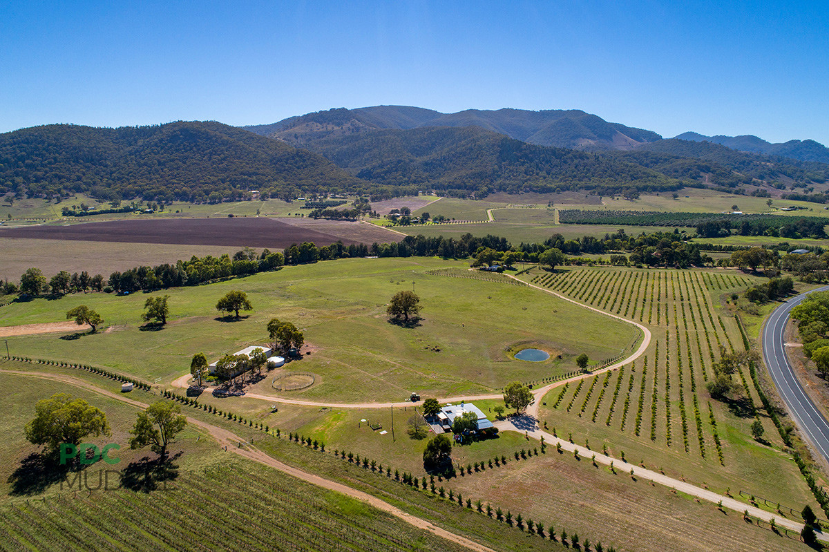  51 acres with river frontage, two houses and irrigation just out of